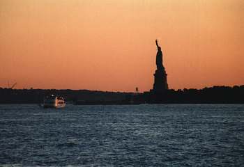 Statue Of Liberty in the apricot-colored sky